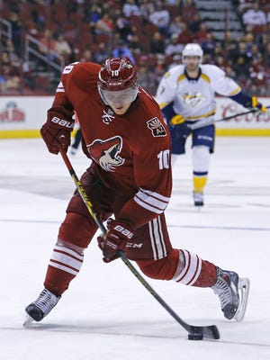 Arizona Coyotes left wing Martin Erat (10) shoots against the Nashville Predators during the second period of their NHL game Saturday, March 9, 2015 in Glendale, Ariz.