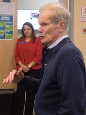 Sen. Bill Nelson talks with a group of Cybersecurity students and faculty at University of West Florida during at tour of the university's "battle lab" Friday afternoon May 5, 2017.