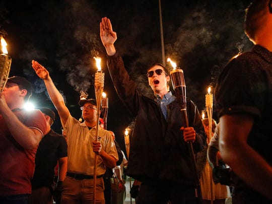 Multiple white nationalist groups march with torches through the UVA campus in Charlottesville on Aug. 11, 2017. When met by counter protesters, some yelling "Black lives matter," tempers turned into violence. Multiple punches were thrown, pepper spray was sprayed and torches were used as weapons.