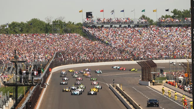 The green flag drops at the Indianapolis Motor Speedway for the start of the Indianapolis 500 on Sunday morning, May 25, 2014.