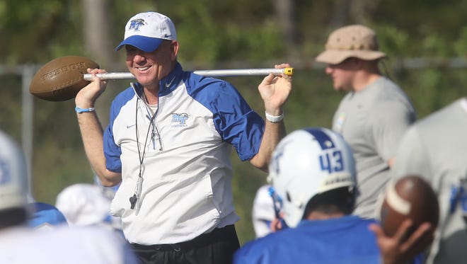 MTSU head coach Rick Stockstill watches as his players warm up for their first practice in the Bahamas on Monday, Dec. 21, 2015.