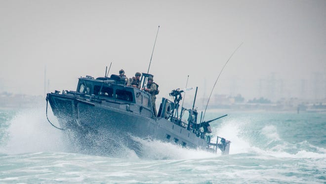 Riverine Command Boat (RCB) 805, assigned to Commander, Task Group (CTG) 56.7, transits through rough seas on Oct. 30, 2015, during patrol operations in the Arabian Gulf. 