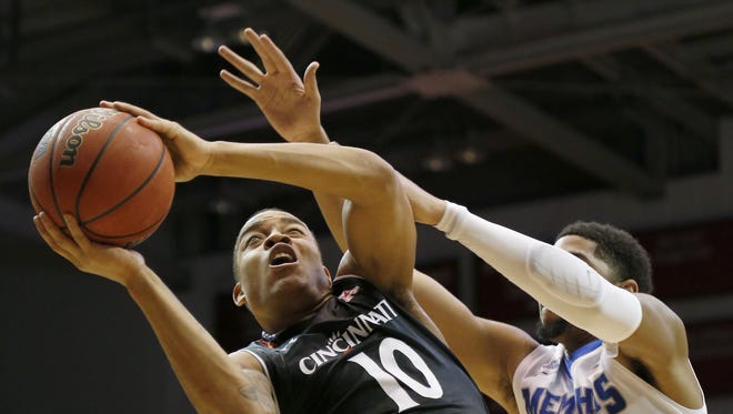 Bearcats guard Troy Caupain shoots a layup during the first half of Thursday's win over Memphis.