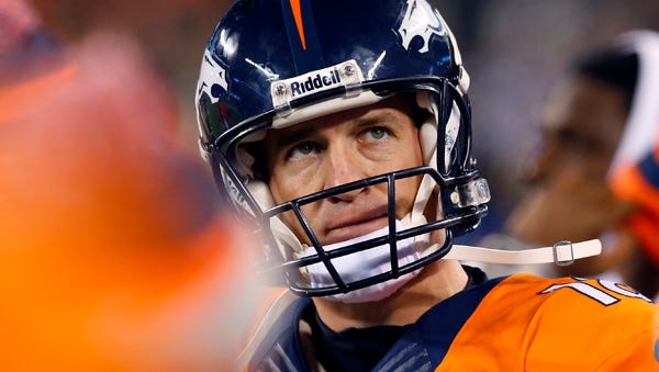 Denver Broncos' Peyton Manning looks at the scoreboard during the second half of the NFL Super Bowl XLVIII football game against the Seattle Seahawks on Sunday, Feb. 2, 2014, in East Rutherford, N.J. (AP Photo/Paul Sancya)