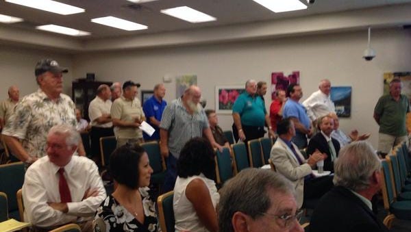 Vets stand after a Bonita Springs zoning board recommended approval of VFW post 4254's request to serve alcohol