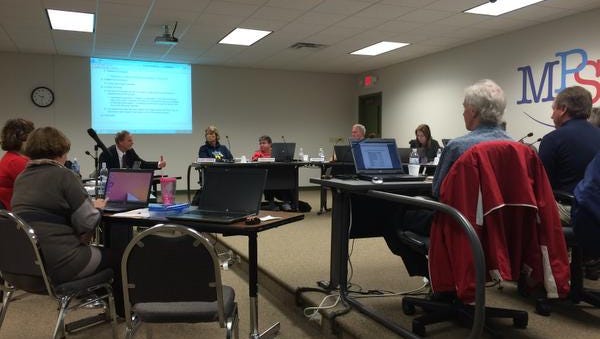 The Manitowoc Public School District Board of Education discusses budget challenges during their meeting Tuesday night.