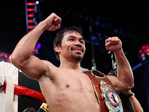 Manny Pacquiao celebrates after defeating Jessie Vargas