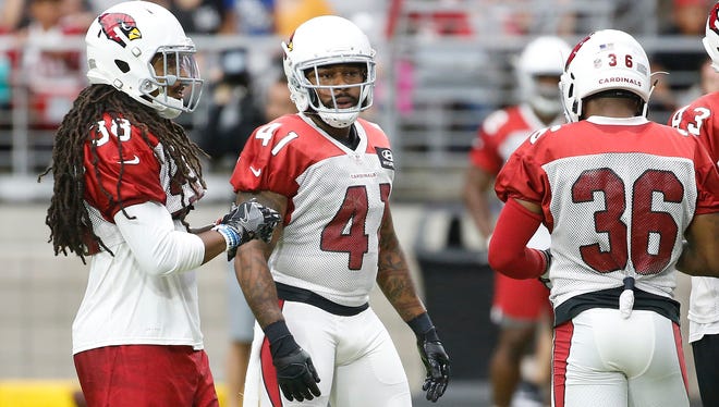 Cardinals Tre Boston (38), Antoine Bethea (41) and Budda Baker (36) take the field together defensively during training camp at University of Phoenix Stadium in Glendale, Ariz. on July 29, 2018. 