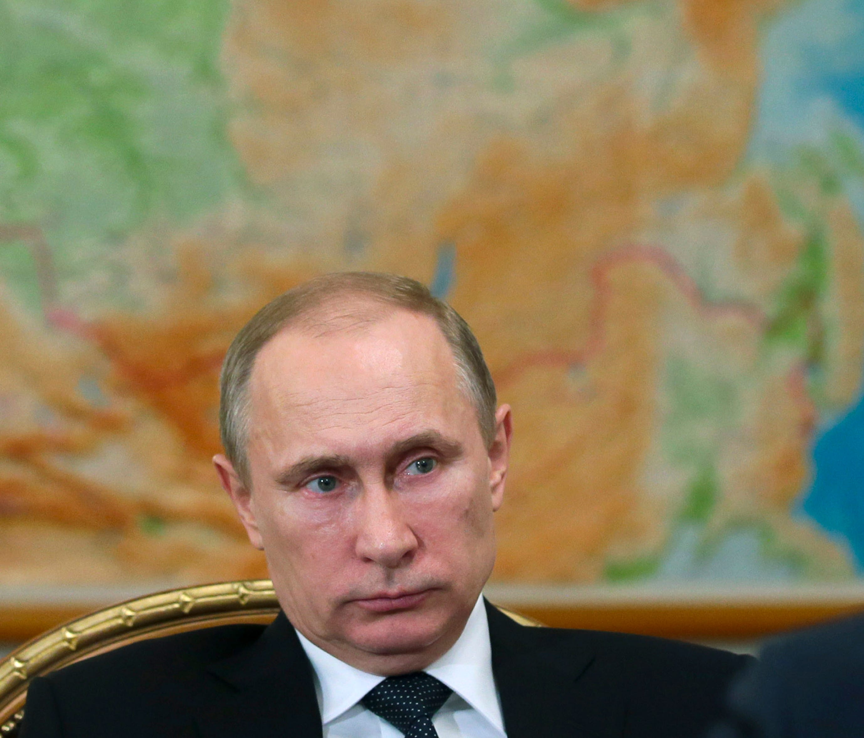 Russian President Vladimir Putin meets with Tyumen region governor Vladimir Yakushev in the Novo-Ogaryovo residence outside Moscow, Wednesday, Feb. 19, 2014.