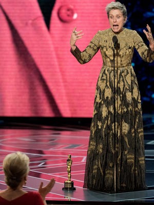 Frances McDormand urges other Oscar-nominated women in the audience to stand during her acceptance speech at the Academy Awards on Sunday.