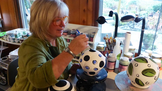 Artist Mary Lou Zeek, who founded the Salem Art Association's annual Clay Ball fundraiser, created a limited edition of clay balls that will be up for auction at this year's ball on Feb. 27.