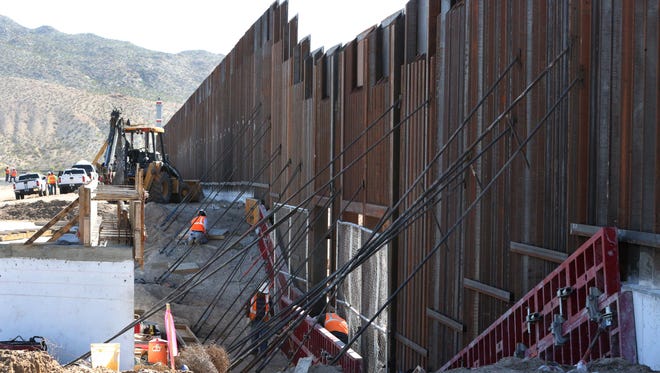 Work continues on an 18-foot high section of the border fence near Sunland Park, N.M.