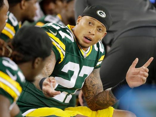 Green Bay Packers safety Josh Jones (27) talks to teammates