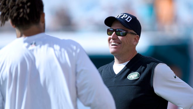 Dolphins defensive tackle Jared Odrick chats with New York Jets head coach Rex Ryan during Week 17 of the 2014 season.