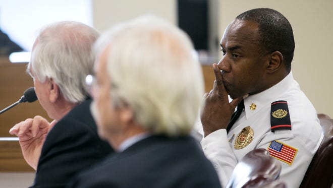 Shelby County Fire Director Alvin Benson (right) listens as Tom Needham, director of Public Works, addresses the Shelby County Commission public works committee as they discuss expanding ambulance service through the Shelby County Fire Department instead of a third party contract.