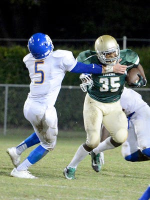 Bolivar's Keyon Crisp tries to get away from a Jackson Christian defender in a game last season.