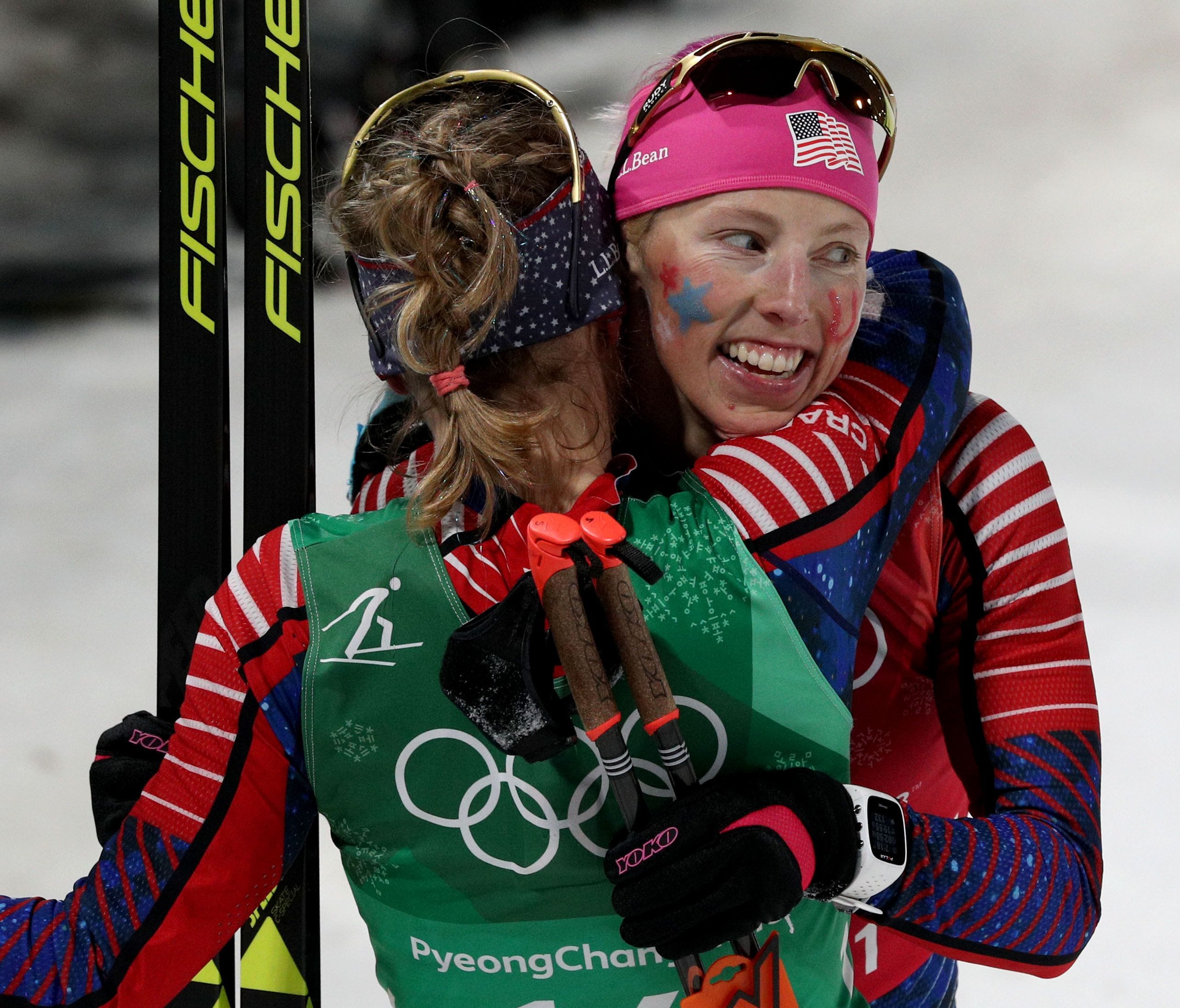 Jessie Diggins (left) and Kikkan Randall  celebrate winning the gold medal in the cross-country skiing team sprint freestyle final during the Pyeongchang 2018 Olympic Winter Games at Alpensia Cross-Country Centre.