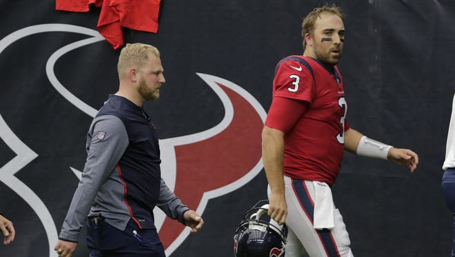 Tom Savage heads to the locker room for further evaluation after suffering head trauma in Sunday's game.