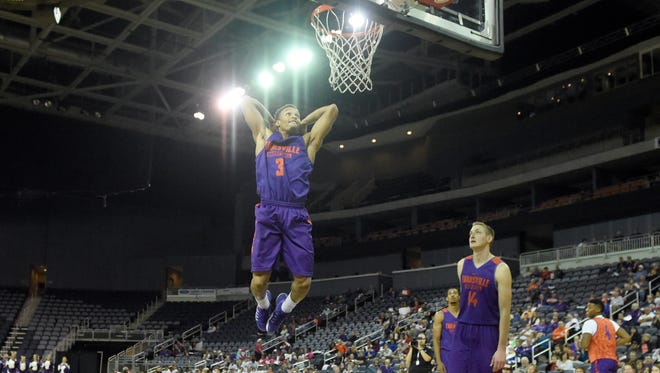 University of Evansville senior Jaylon Brown goes up high to throw down a dunk during the slam dunk exhibition as the men's and women's basketball teams perform during Hoopfest at the Ford Center on Thursday.  The event also featured introductions to the teams, a 3-point shooting team challenge and team scrimmages.