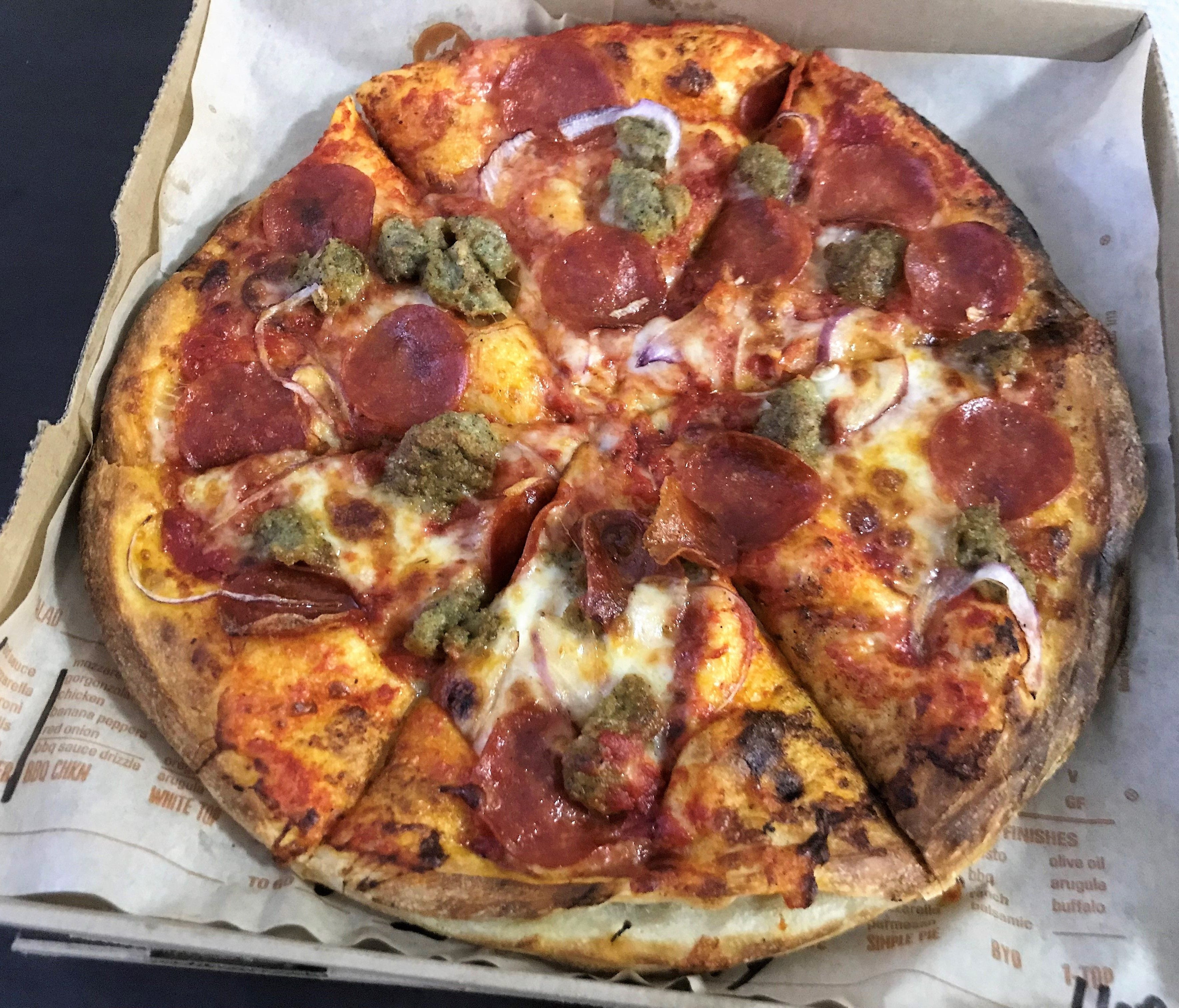 One of seven pre-designed signature pizzas at Blaze, the Meat Eater comes with pepperoni, crumbled meatballs, red onion, mozzarella and red sauce.