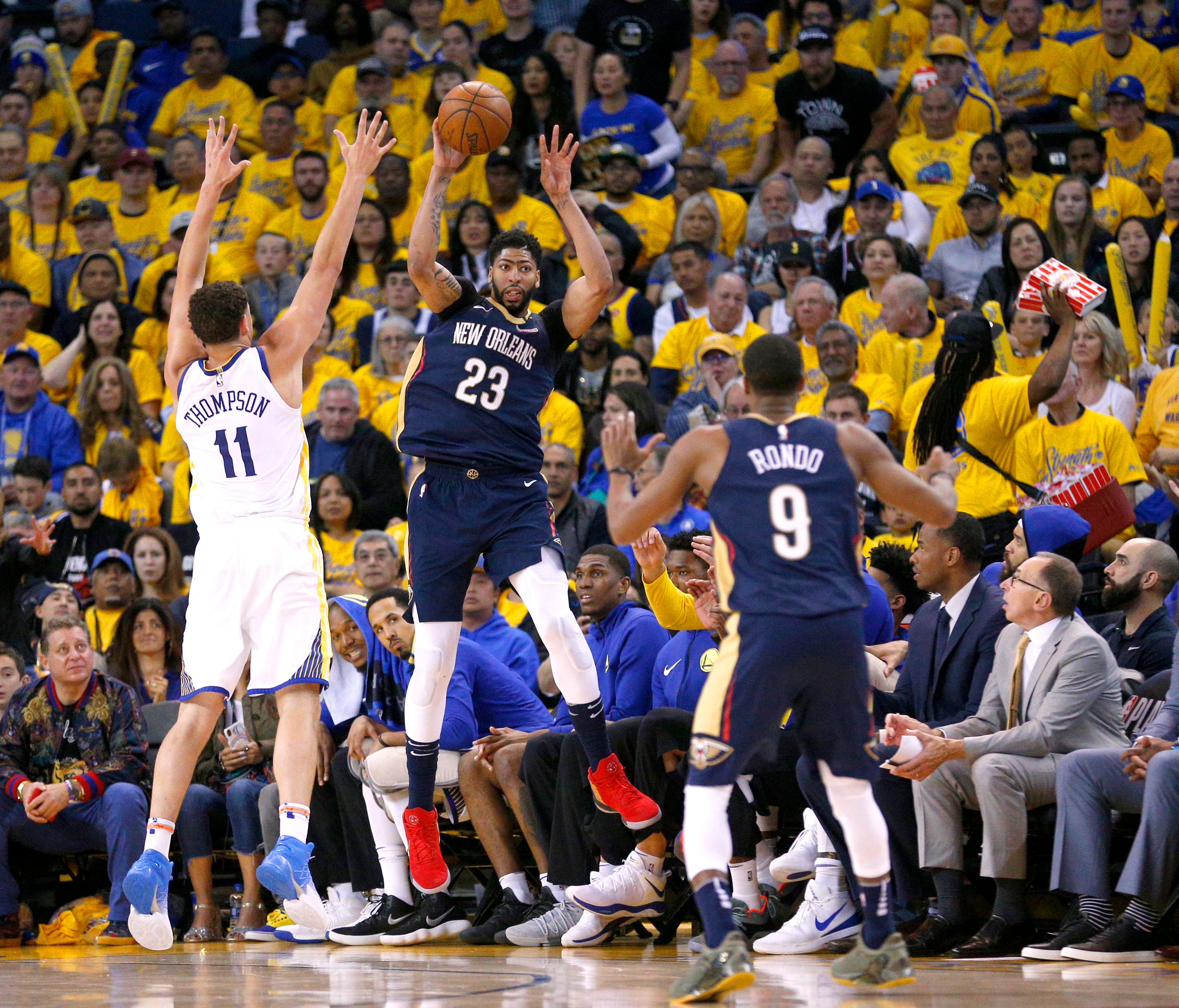 New Orleans Pelicans forward Anthony Davis (23) saves the ball from going out of bounds next to Golden State Warriors guard Klay Thompson (11) in the third quarter in game one of the second round of the 2018 NBA Playoffs at Oracle Arena.
