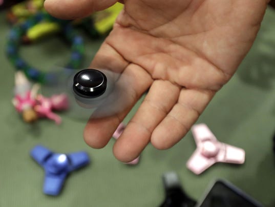 Fid spinners Mom warns parents about dangers of toy after