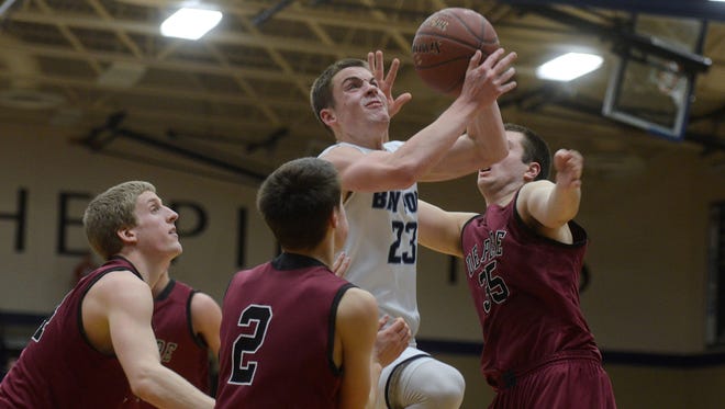 Bay Port's Zach Lorbeck shoots in the second quarter of  their game at Bay Port High School on Friday, Jan. 30, 2015.
