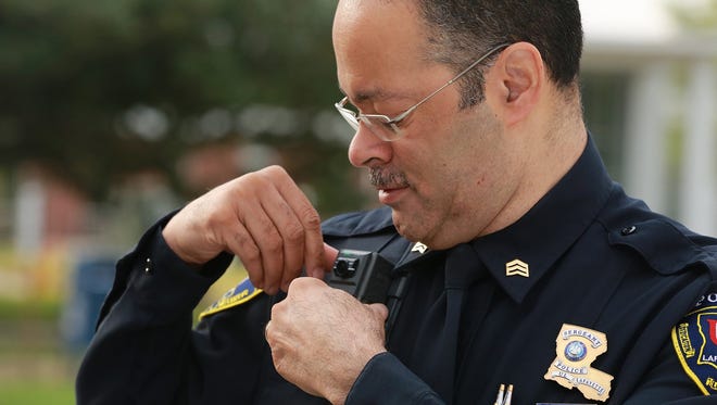 UL police Sgt. Billy Abrams adjusts a new body camera.