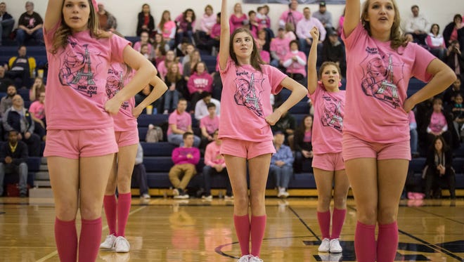 Marysville cheerleaders perform during a basketball game Friday, Feb. 5, 2016 at Marysville High School.