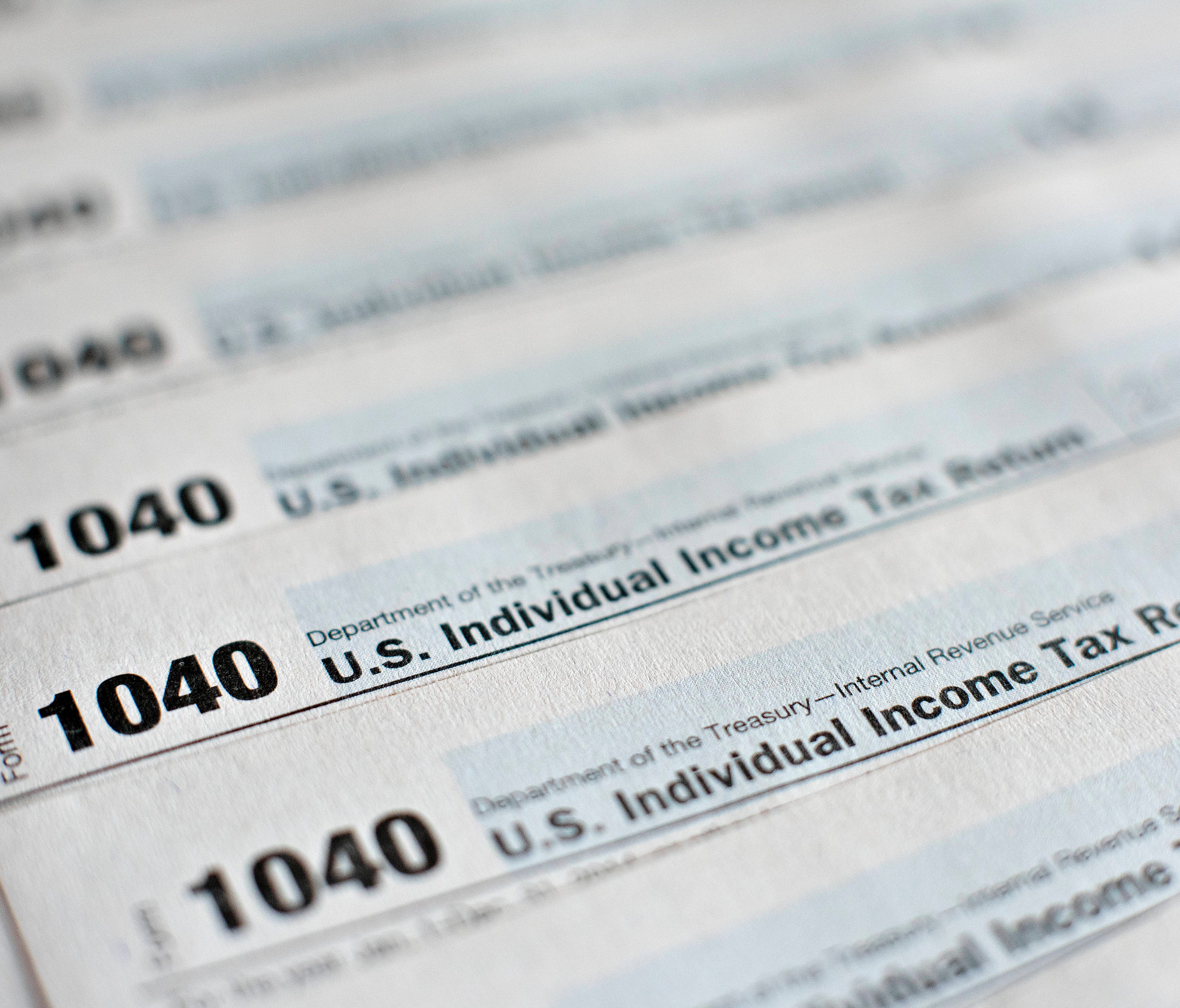 U.S. Department of the Treasury Internal Revenue Service (IRS) 1040 Individual Income Tax forms for the 2014 tax year are arranged for a photograph in Tiskilwa, Illinois, U.S., on Monday, March 16, 2015.