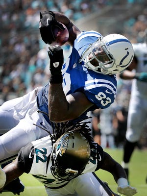 Indianapolis Colts Dwayne Allen stumbles over Jacksonville Jaguars Winston Guy Jr. for a second quarter touchdown in a Week 3 game.