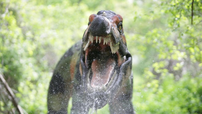 A Baryonyx sprays water during the Dinosauria dinosaur exhibit at the Detroit Zoo in Royal Oak in 2009. The zoo has taken steps to tone down the sound.
