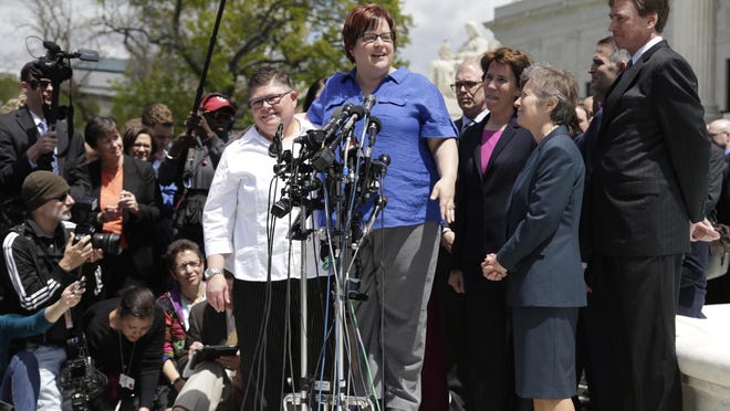Jayne Rowse, left, and April DeBoer speak with their attorneys, Carole Stanyar and Mary Bonauto, during a news conference after arguments were heard in their case at the U.S. Supreme Court in Washington, D.C., in April. The Supreme Court is expected to rule on the case, which could legalize same-sex marriages nationwide, before the end of the month.