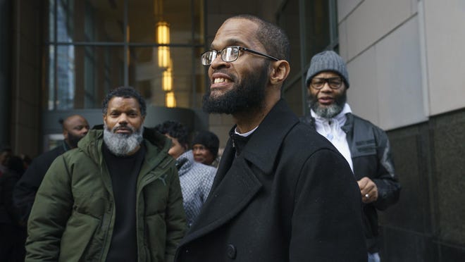 Theophalis Wilson, with friends and family behind him, walks out of the Criminal Justice Center in Philadelphia after being exonerated for a triple murder that took place when he was a teenager, for which he served 28 years in prison.