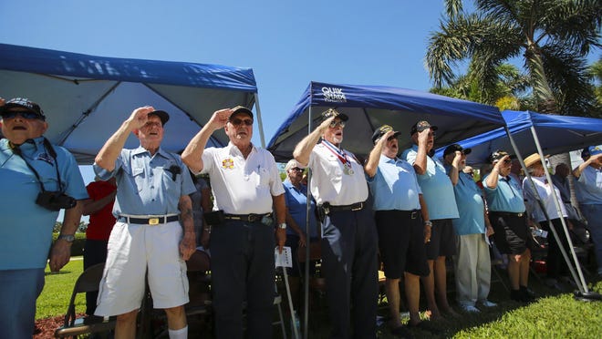 The city of Boynton Beach and Boynton Beach Veterans honored and remembered the 75th Anniversary of D-Day during a ceremony at Veterans Memorial Park Thursday in Boynton Beach. Here, veterans salute during the National Anthem. At the end of the ceremony, a monument to commemorate the D-Day landings was unveiled.