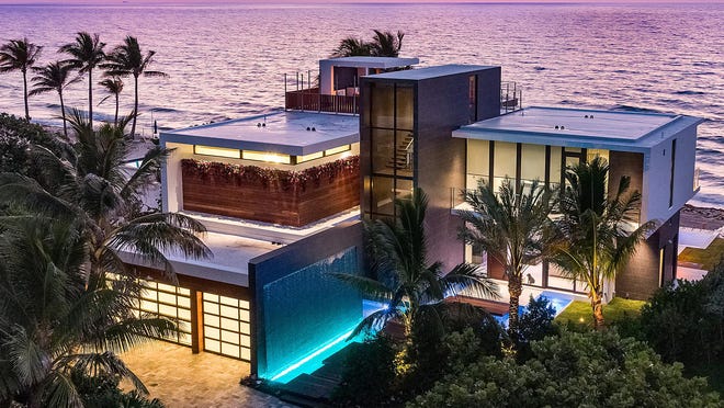 The oceanfront house that just sold for a recorded $10.1 million at 3492 S. Ocean Blvd. in South Palm Beach has been described as "tropical modern" by developer Frank McKinney.