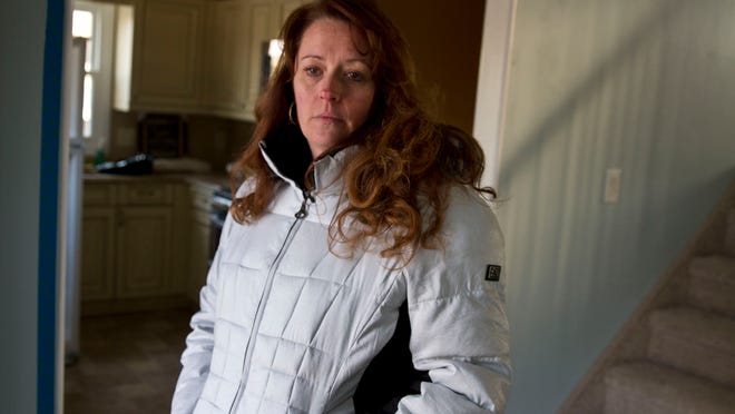 Debra Corrado of Toms River walks through her superstorm Sandy damaged home. She and her husband have completed most of the work , but the home must now be elevated. The cost of the entire project has put the family in jeopardy of foreclosure. Doug Hood/Staff Photographer @dhoodhood