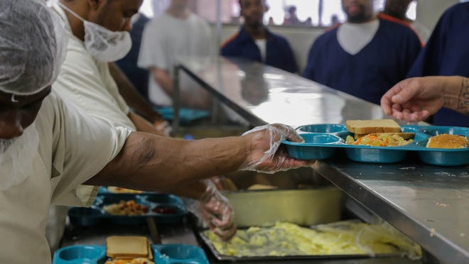A fired Aramark worker alleges that the prison food provider's kitchen practices endanger health and food safety.
