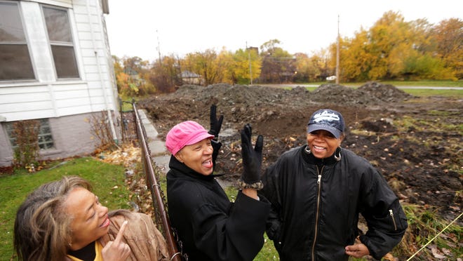 
Detroit sisters Janice Hurt-Clarke, 56; Hattie Sanders, 60; and Vera Hurt, 68, show off the empty lot next to their family home where a vacant house decayed for more than 10 years — until Friday when it was torn down by Hantz Farms, the group behind Detroit’s largest urban agriculture effort. 
