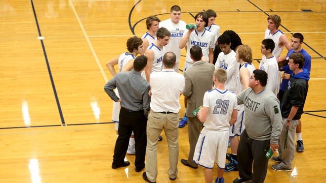 McNary takes a timeout in the first half of the Oregon City vs. McNary boy's basketball game at McNary High School in Keizer on Friday, Jan. 2, 2015. McNary leads 27-25 at the half.
