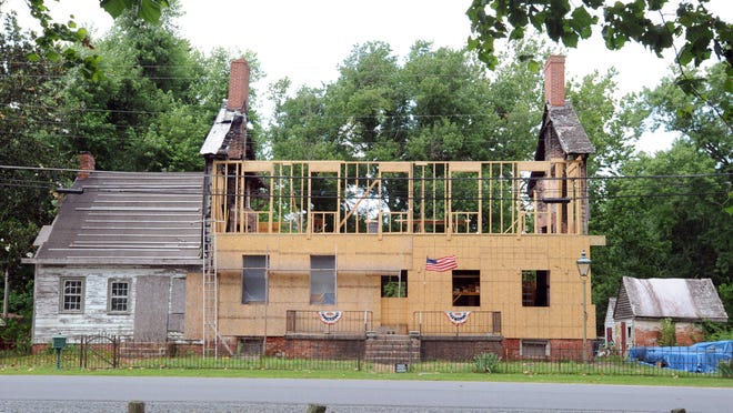 Don Martin and his wife, Kathy, are slowly rebuilding the 19th-century Cannon House, which was destroyed by fire four years ago.
