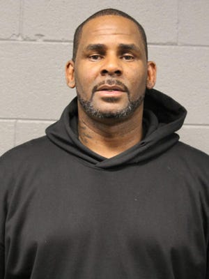 R&B singer R. Kelly is photographed during booking Friday, Feb. 22, 2019, at a police station in Chicago.