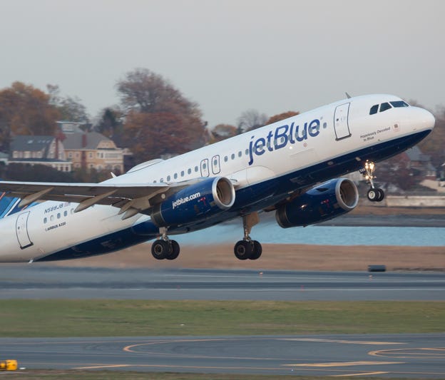 A JetBlue Airbus A320 takes off from Boston Logan International Airport in November 2016.