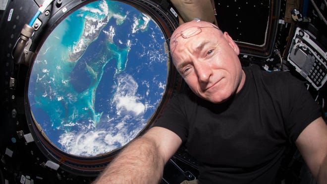 NASA astronaut Scott Kelly poses for a selfie photo in the "Cupola" of the International Space Station. On Friday, Oct. 16, 2015, Kelly broke the U.S. record for the most time spent in space.