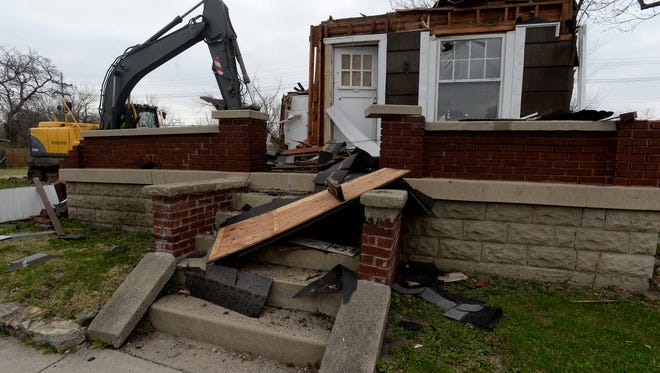 Richmond's Blight Elimination Project hit a milestone Wednesday, March 23, 2016 when the 100th home, located on Sheridan Street, was demolished.