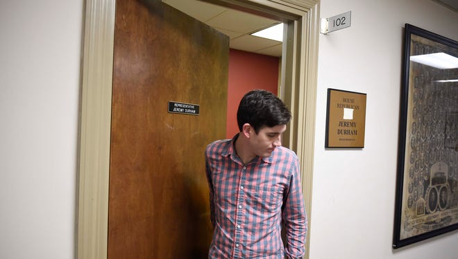 Legislative assistant Zach Dean leaves Rep. Jeremy Durham's office April 8, 2016, in Nashville.