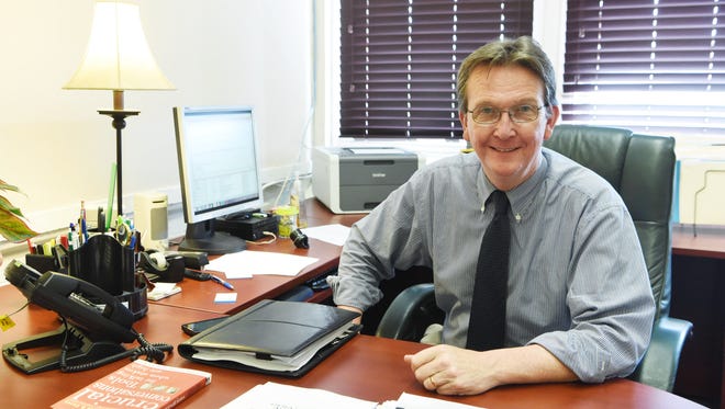Brian Doyle, CEO of Family Services, Inc., poses for a portrait at his desk on June 28.
