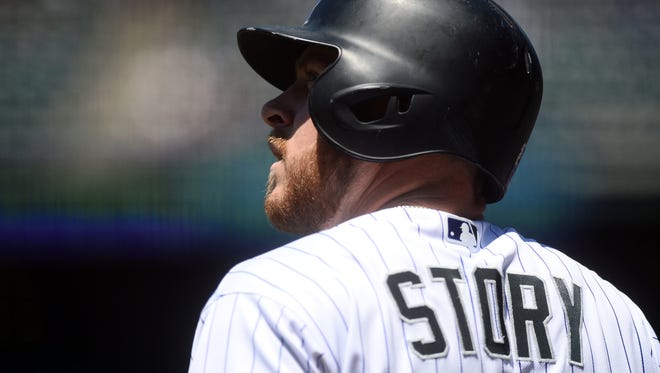 Colorado Rockies shortstop Trevor Story (27) looks up while on deck in the first inning of the game against the Arizona Diamondbacks at Coors Field on June 26 in Denver.
