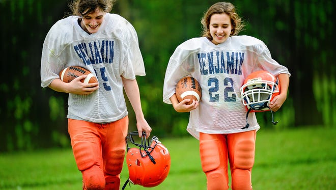 “We still have a great time all together, and we treat them with respect because they are our friends and teammates,” says The Benjamin School eighth-grade football teammate Cole Jernstedt of Madeline Hart (left) and Emma Shirzad. “I’m really happy they joined the team.”