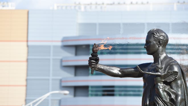 The Torchbearer statue at the University of Tennessee represents the Volunteer Creed: “One that beareth a torch shadoweth oneself to give light to others.”